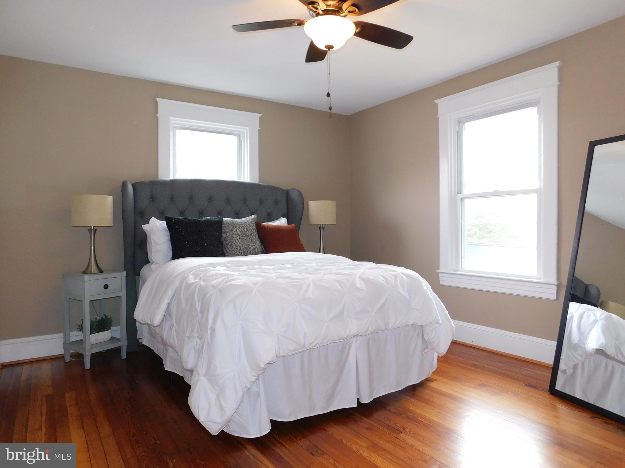 606 Andover Road Linthicum, MD 21090 - Photo 16 of 29 a bedroom with a bed and wooden floor