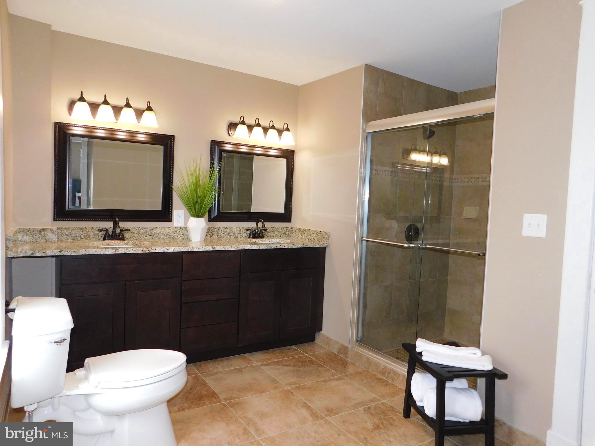606 Andover Road Linthicum, MD 21090 - Photo 17 of 29 a bathroom with a toilet sink and mirror