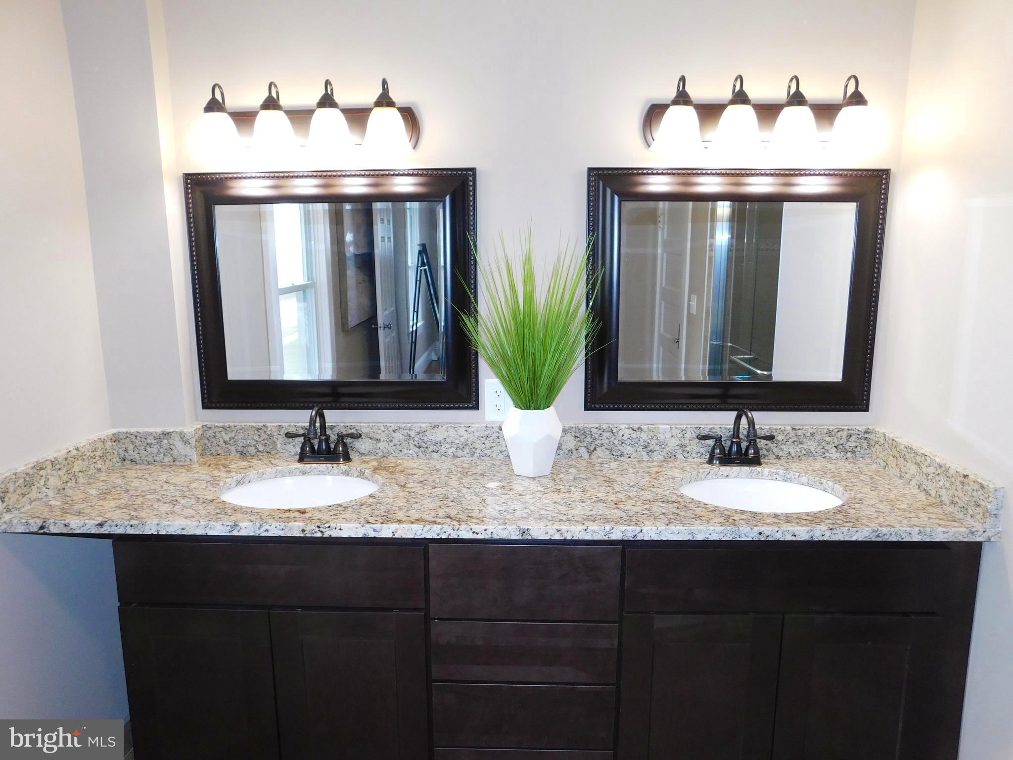 606 Andover Road Linthicum, MD 21090 - Photo 18 of 29 a bathroom with a sink and a mirror