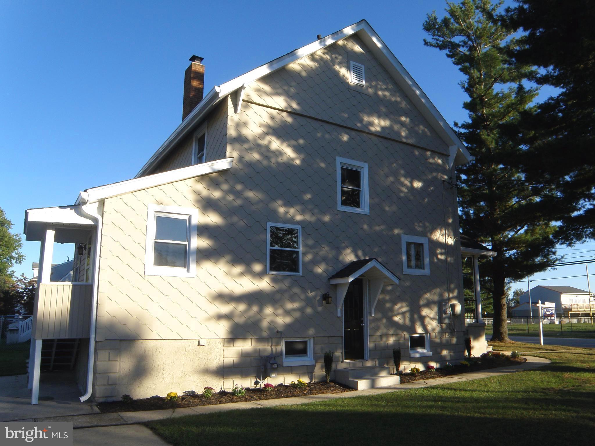 606 Andover Road Linthicum, MD 21090 - Photo 3 of 29 a front view of a house with a yard