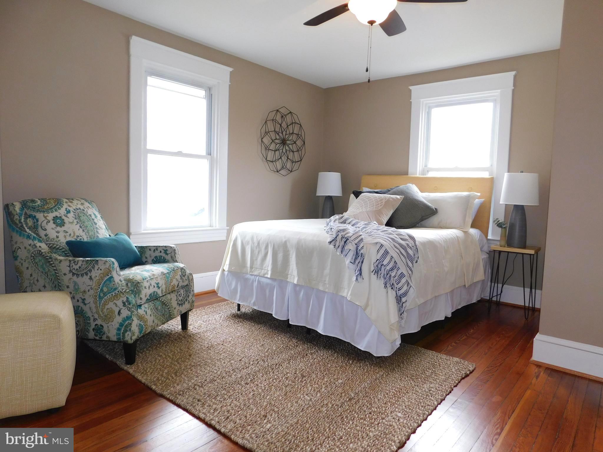 606 Andover Road Linthicum, MD 21090 - Photo 20 of 29 a bedroom with bed couch and window