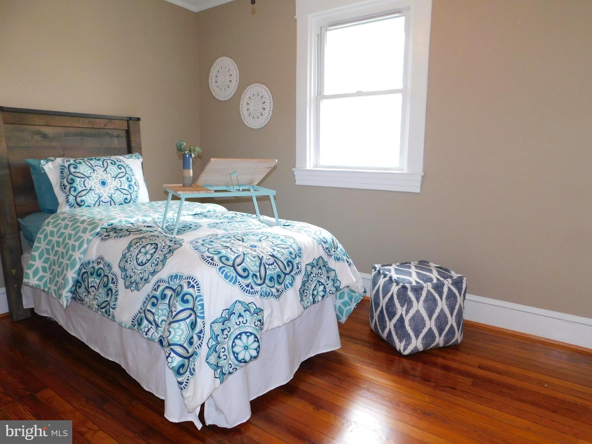 606 Andover Road Linthicum, MD 21090 - Photo 21 of 29 a bedroom with a bed and window