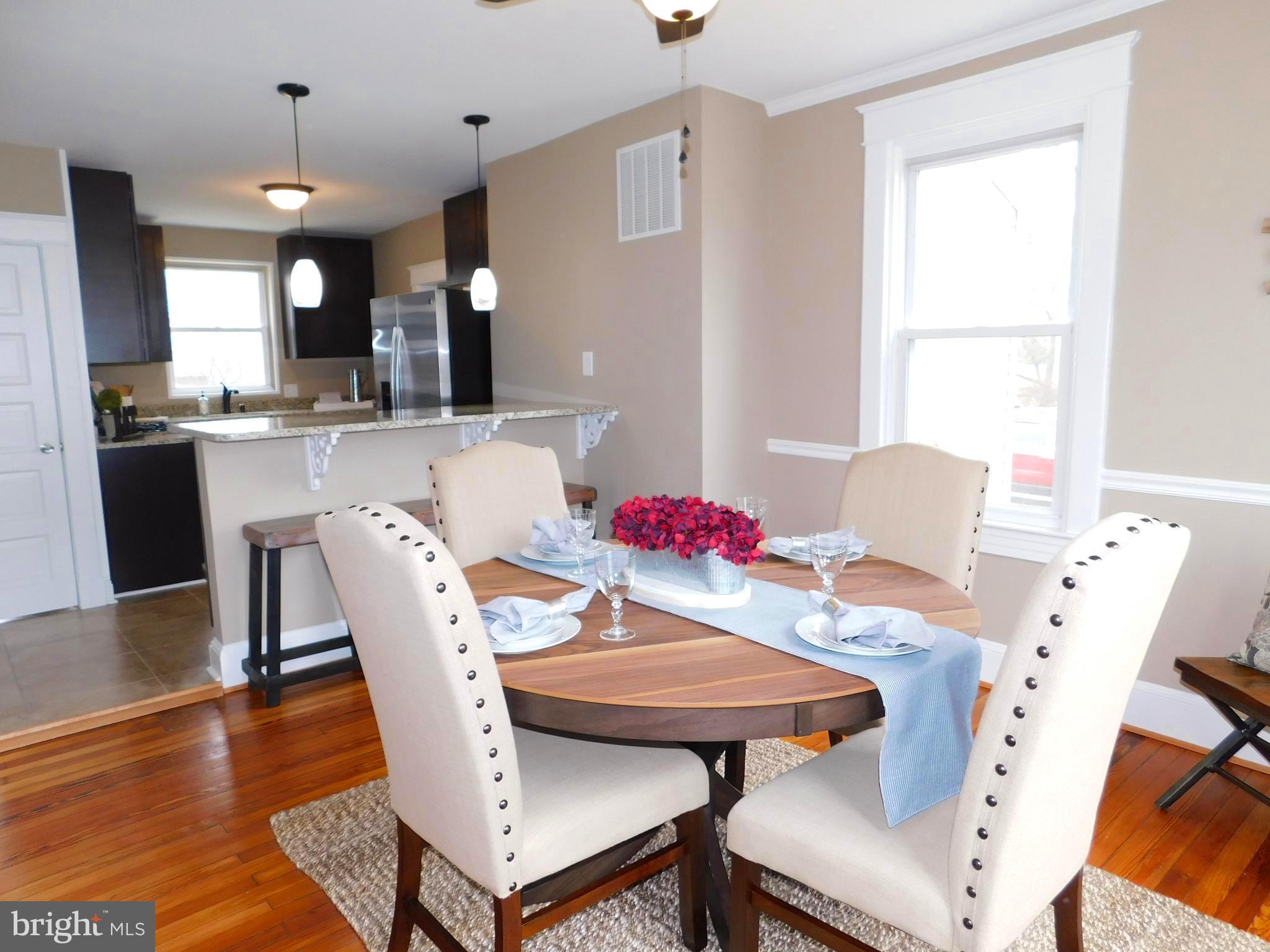 606 Andover Road Linthicum, MD 21090 - Photo 8 of 29 a view of a dining room with furniture window and wooden floor