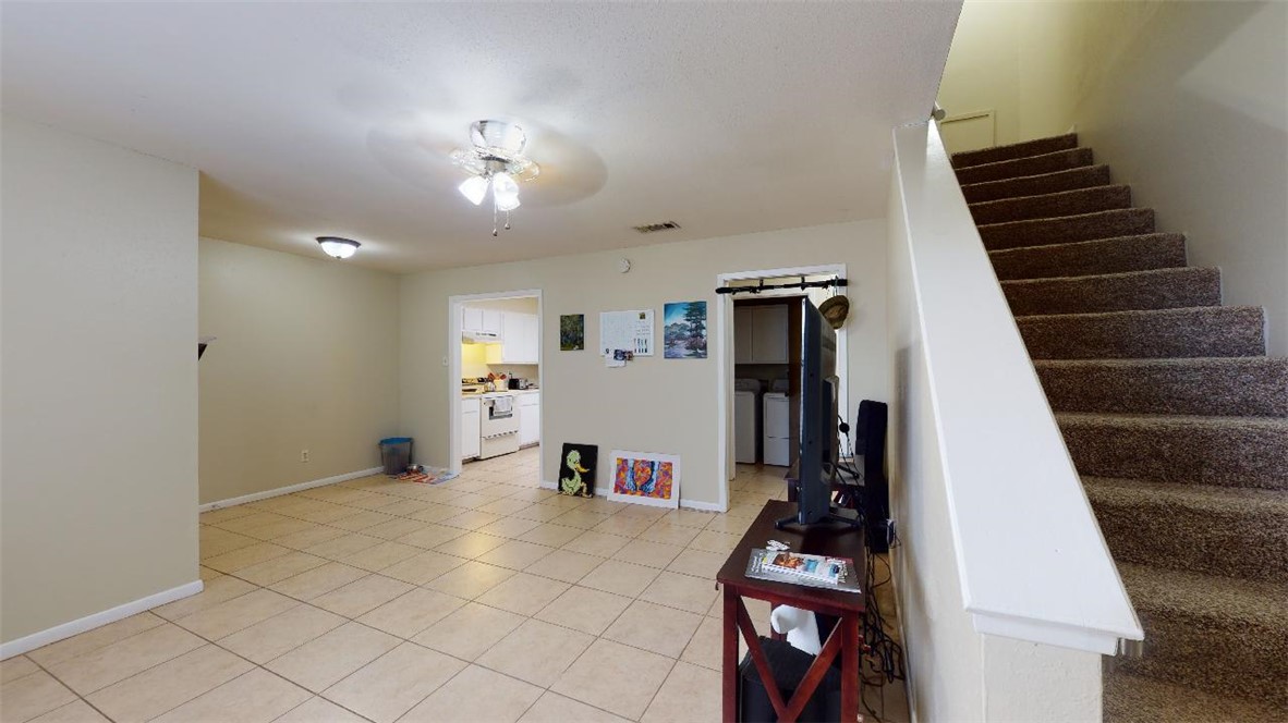 1809 Treehouse Trail, Unit D College Station, TX 77845 - Photo 11 of 23 a view of room with furniture and stairs