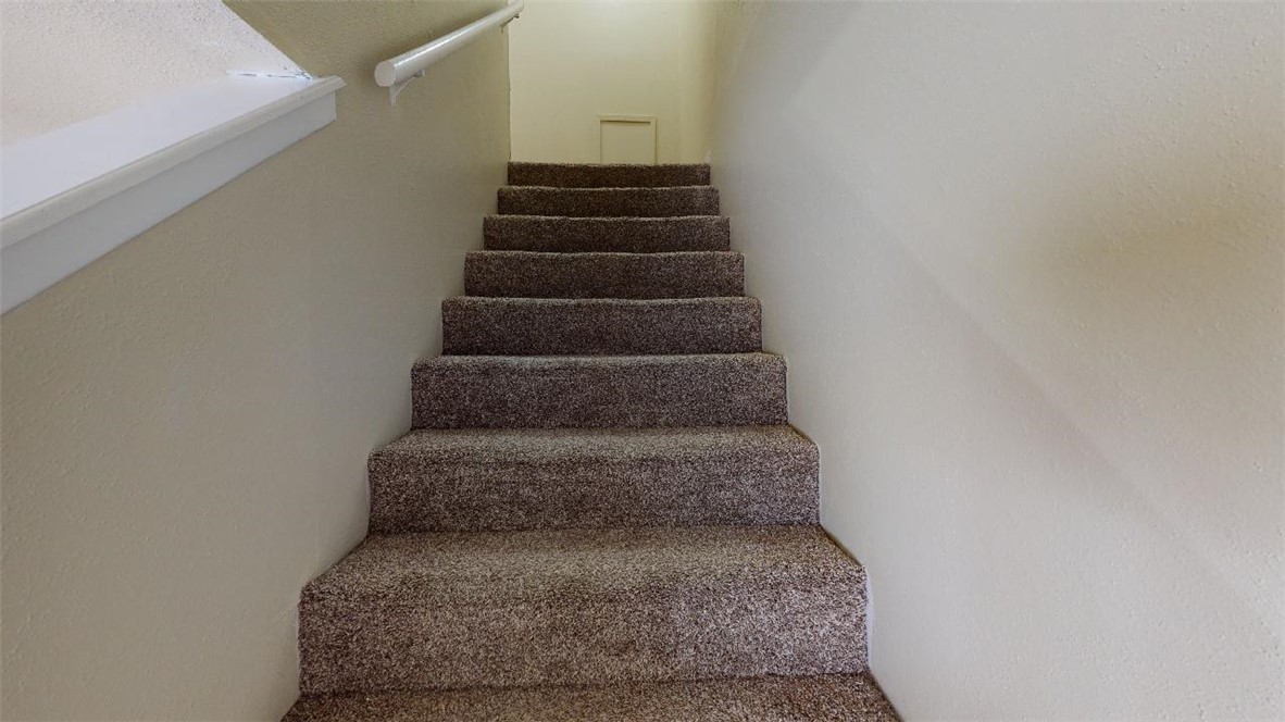 1809 Treehouse Trail, Unit D College Station, TX 77845 - Photo 12 of 23 a view of staircase with white walls