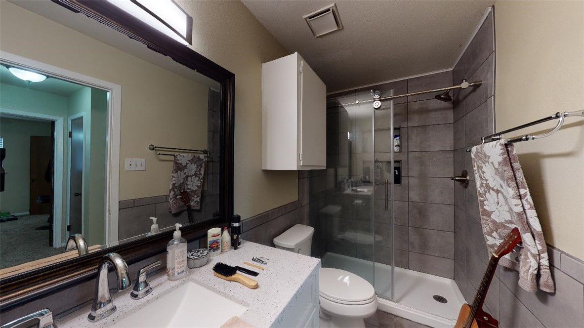 1809 Treehouse Trail, Unit D College Station, TX 77845 - Photo 15 of 23 a bathroom with a sink a toilet and shower