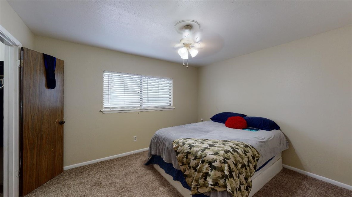 1809 Treehouse Trail, Unit D College Station, TX 77845 - Photo 16 of 23 a bedroom with a bed and a window