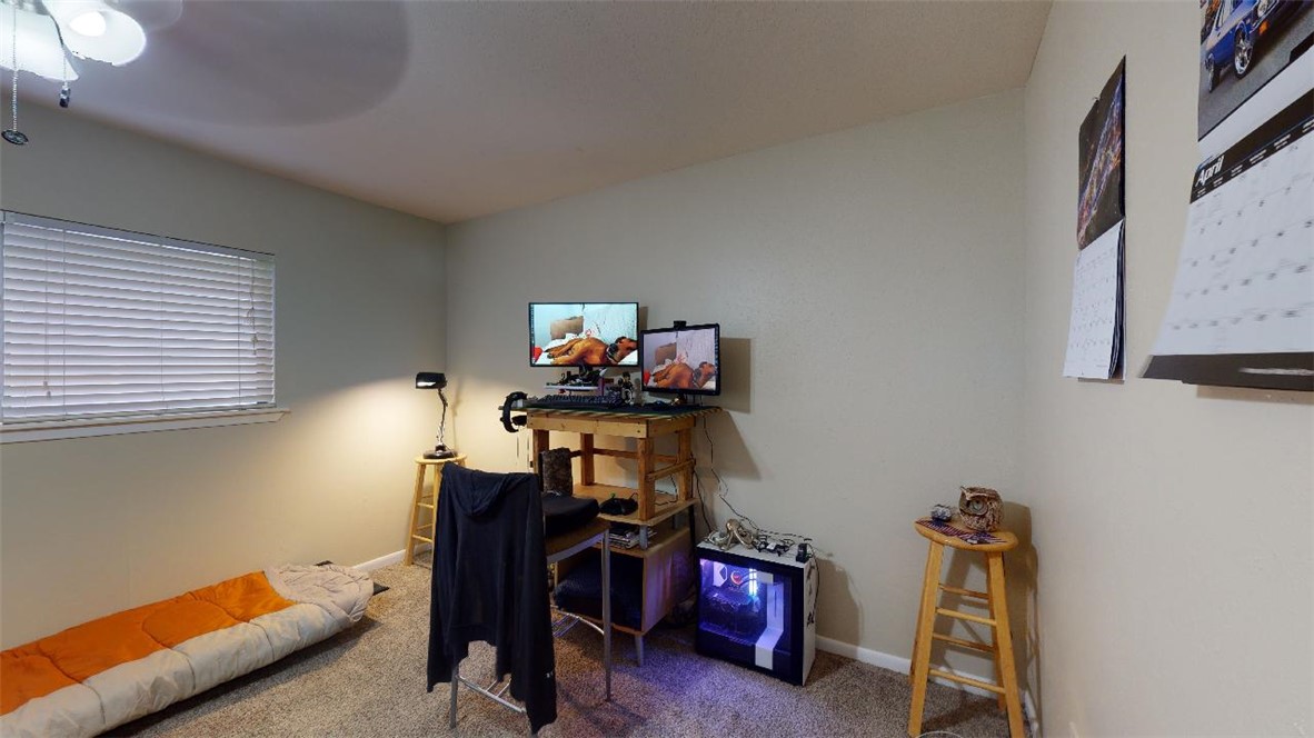 1809 Treehouse Trail, Unit D College Station, TX 77845 - Photo 19 of 23 a room with furniture and wooden floor