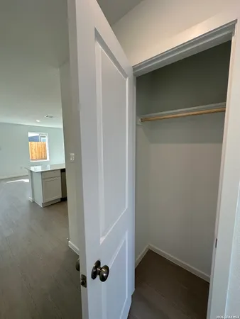 a view of a room with a wardrobe space