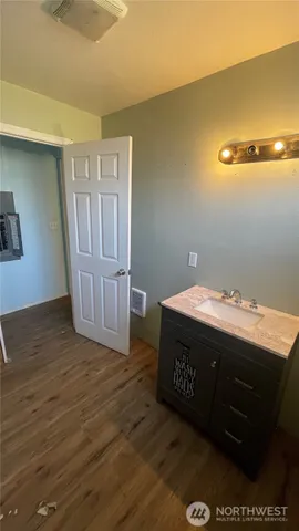 a room with pool table and windows