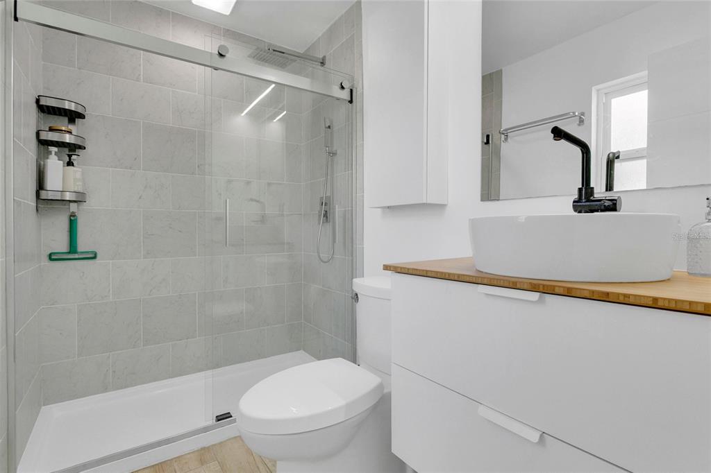 851 Darwin Drive Altamonte Springs, FL 32701 - Photo 13 of 31 a bathroom with a toilet and a shower