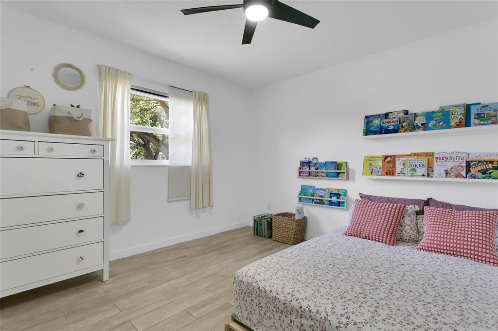 851 Darwin Drive Altamonte Springs, FL 32701 - Photo 14 of 31 a bedroom with a bed dresser and a window