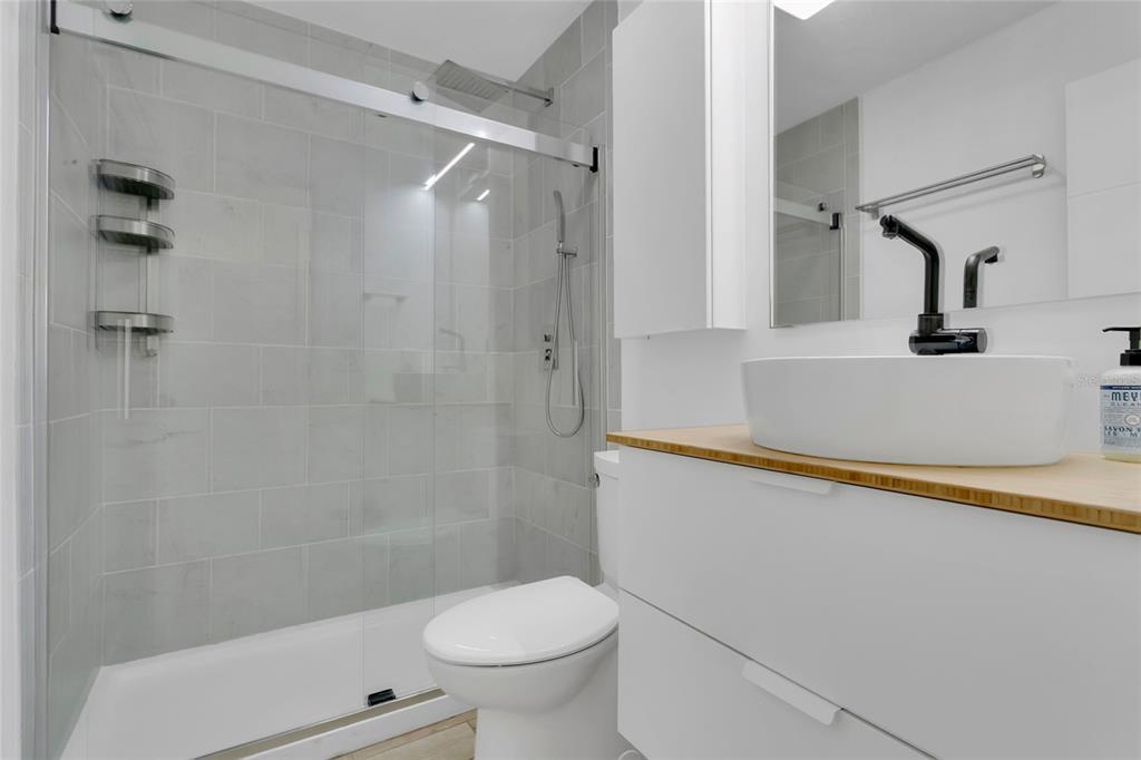 851 Darwin Drive Altamonte Springs, FL 32701 - Photo 15 of 31 a bathroom with a shower and a toilet