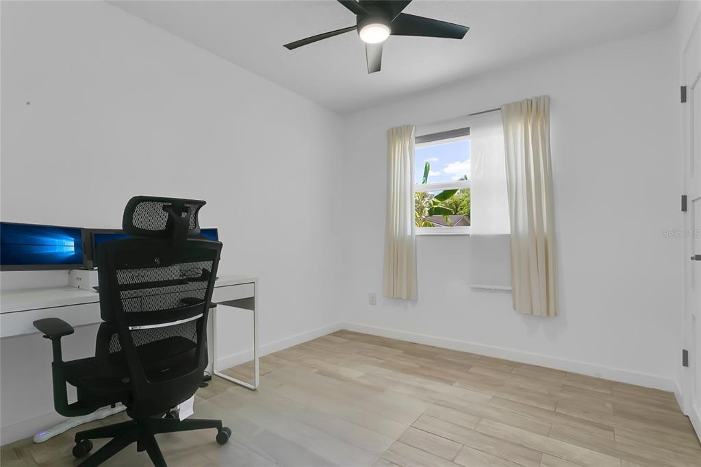 851 Darwin Drive Altamonte Springs, FL 32701 - Photo 16 of 31 a view of a workspace with furniture and a window