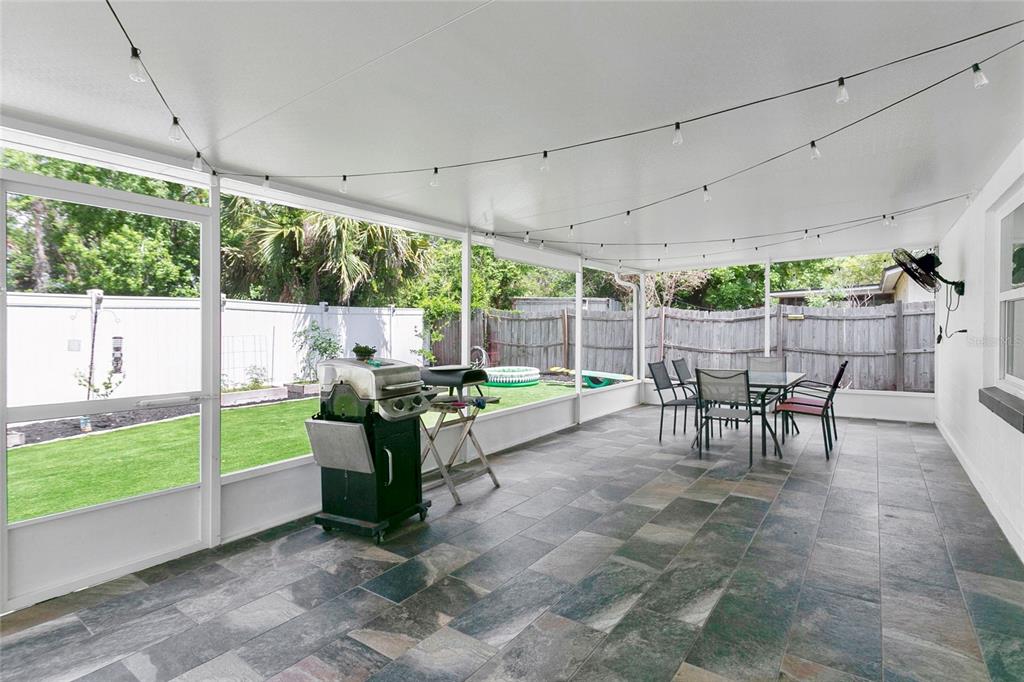 851 Darwin Drive Altamonte Springs, FL 32701 - Photo 17 of 31 a view of a porch with chairs and backyard