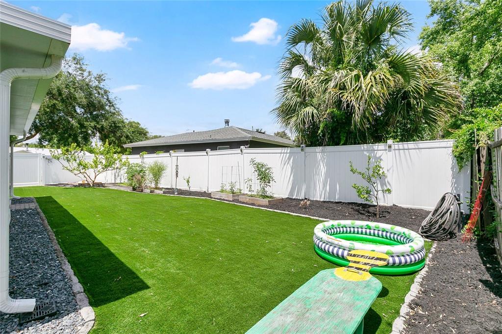 851 Darwin Drive Altamonte Springs, FL 32701 - Photo 19 of 31 a view of a table and chairs in backyard