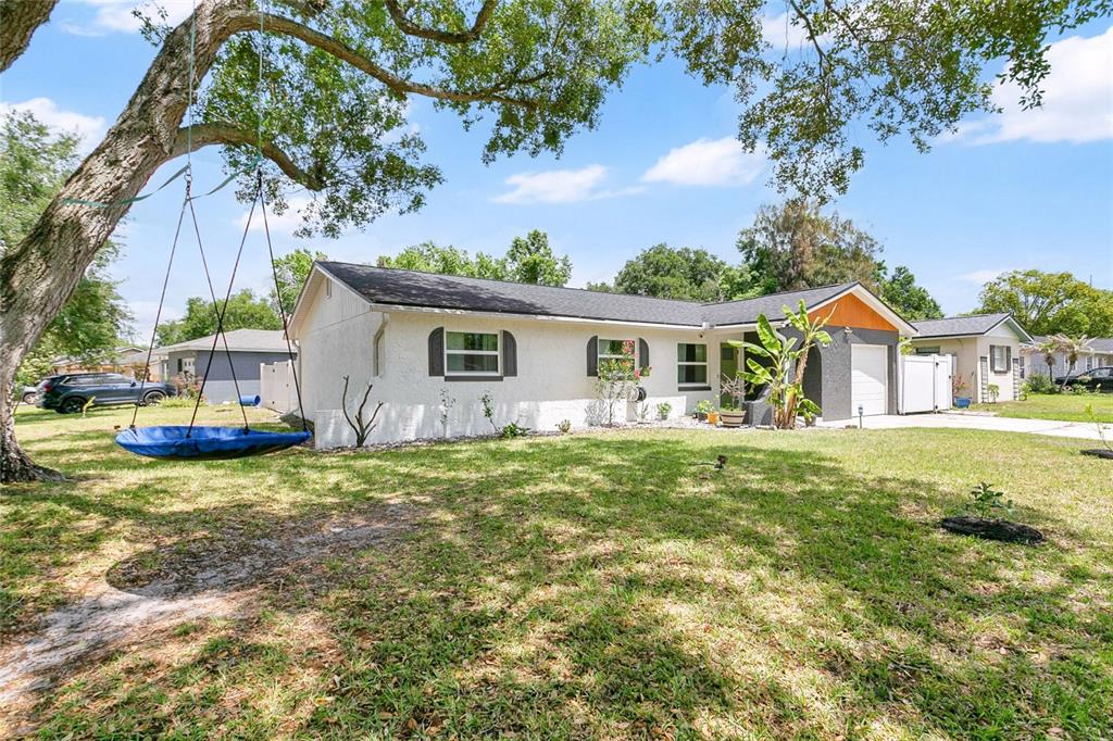 851 Darwin Drive Altamonte Springs, FL 32701 - Photo 2 of 31 a view of a house with a patio