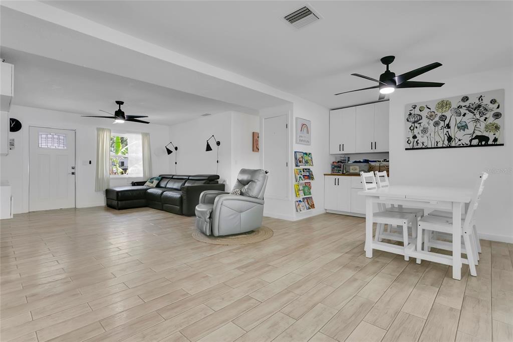 851 Darwin Drive Altamonte Springs, FL 32701 - Photo 7 of 31 a living room with furniture and a wooden floor