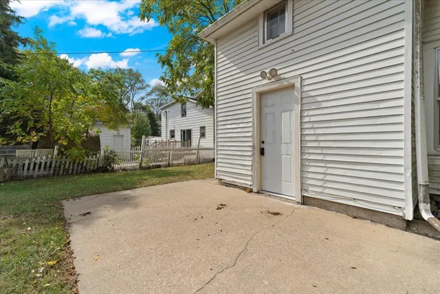 a view of a house with a yard and garage