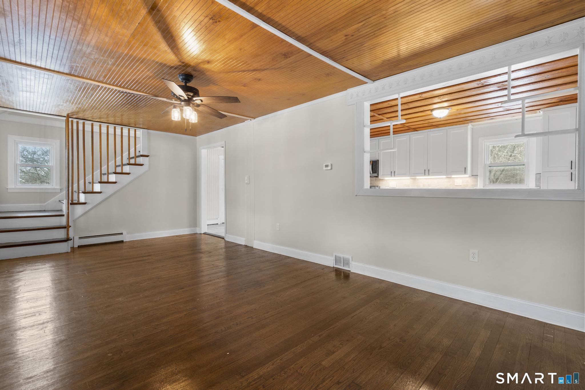 165 Ballamahack Road Windham, CT 06280 - Photo 14 of 40 a view of an empty room with wooden floor and fan