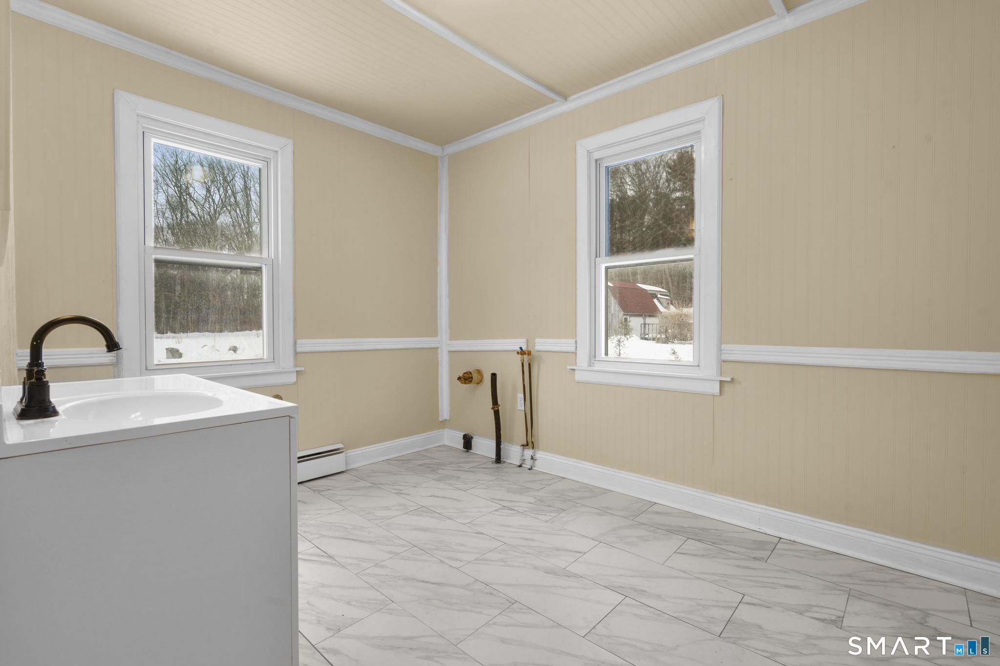 165 Ballamahack Road Windham, CT 06280 - Photo 17 of 40 a view of a room that has a sink and cabinets