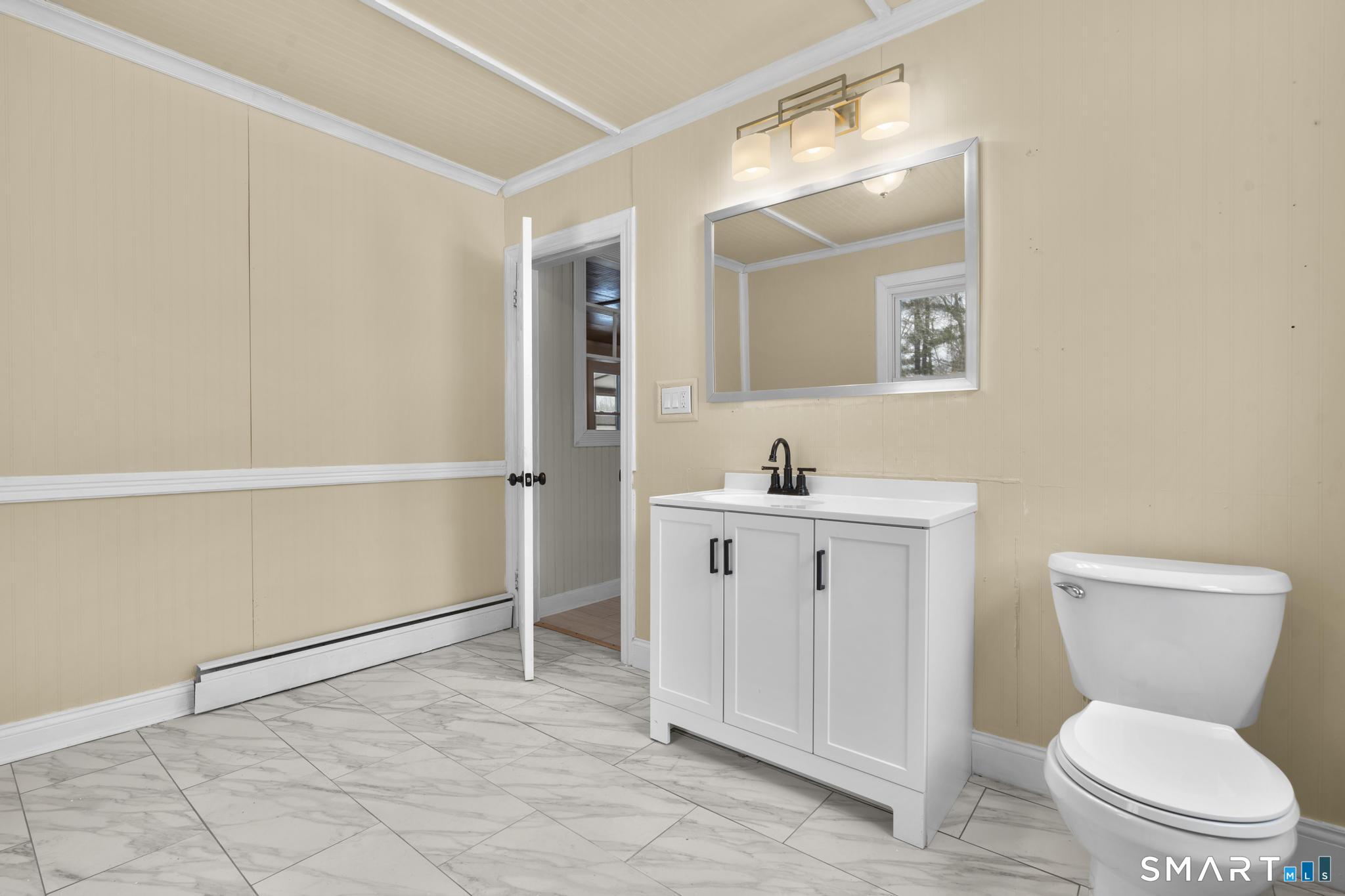 165 Ballamahack Road Windham, CT 06280 - Photo 19 of 40 a bathroom with a toilet sink and mirror