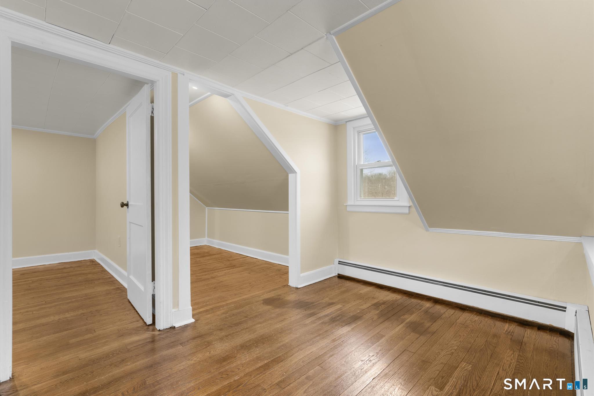 165 Ballamahack Road Windham, CT 06280 - Photo 23 of 40 a view of an empty room with wooden floor