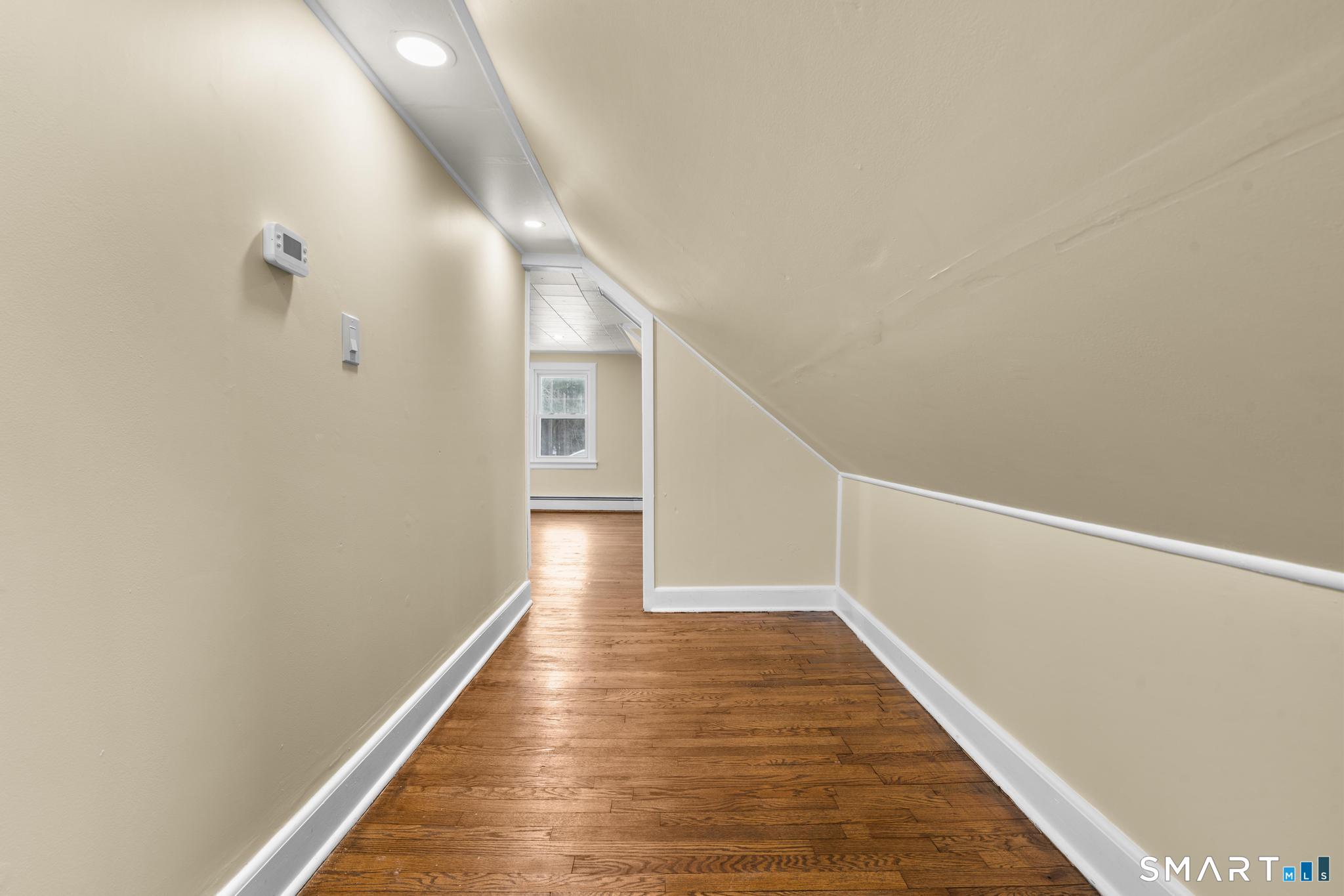 165 Ballamahack Road Windham, CT 06280 - Photo 25 of 40 a view of a hallway with wooden floor