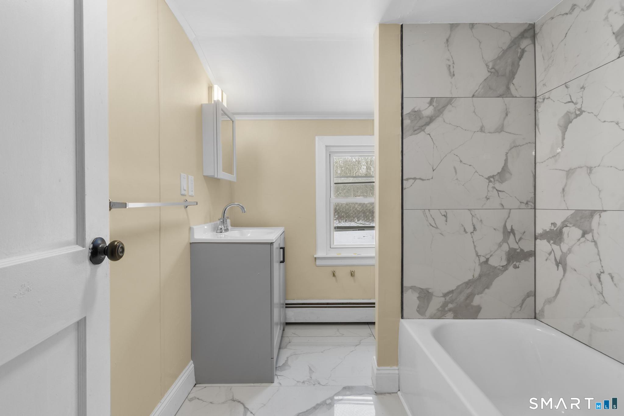 165 Ballamahack Road Windham, CT 06280 - Photo 26 of 40 a bathroom with a bathtub and shower