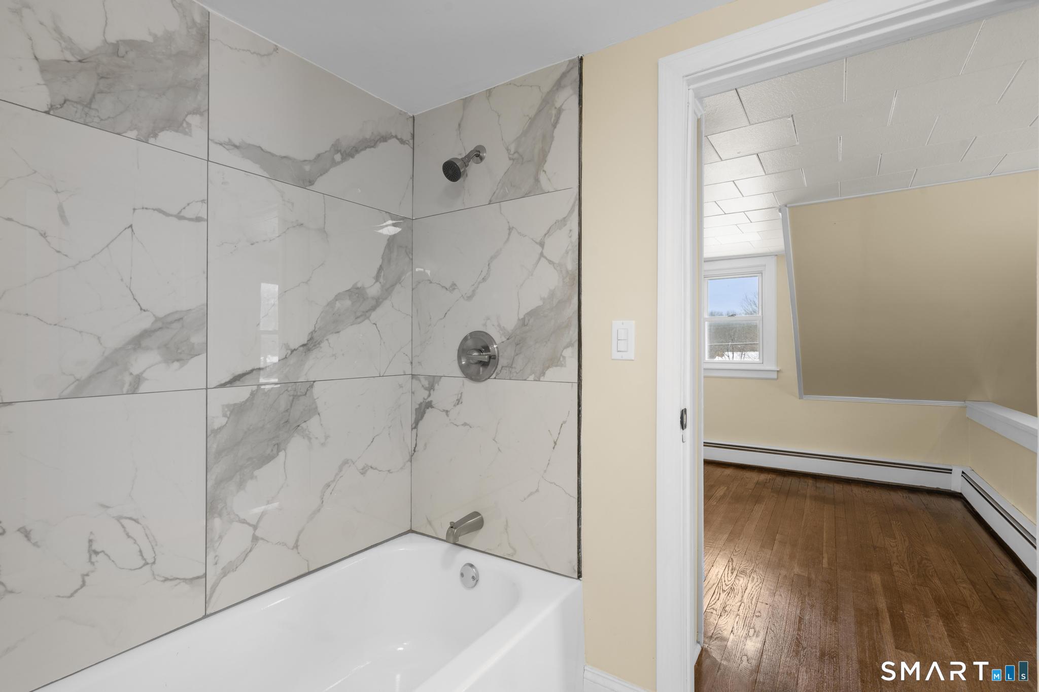 165 Ballamahack Road Windham, CT 06280 - Photo 27 of 40 a bathroom with a tub shower and sink