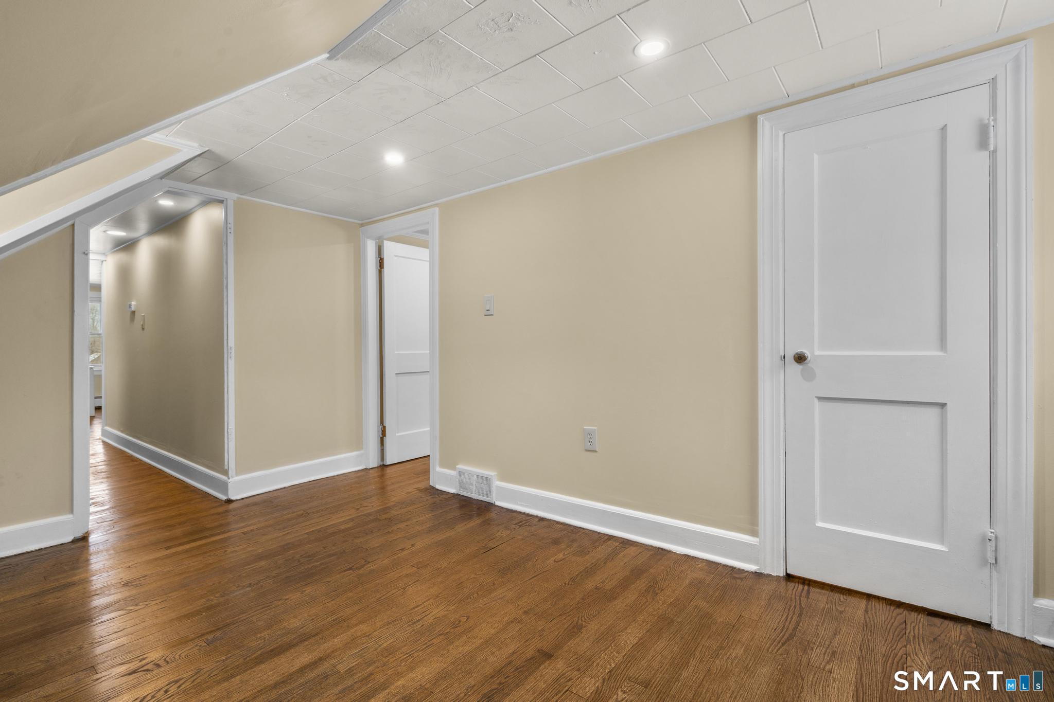 165 Ballamahack Road Windham, CT 06280 - Photo 33 of 40 an empty room with wooden floor