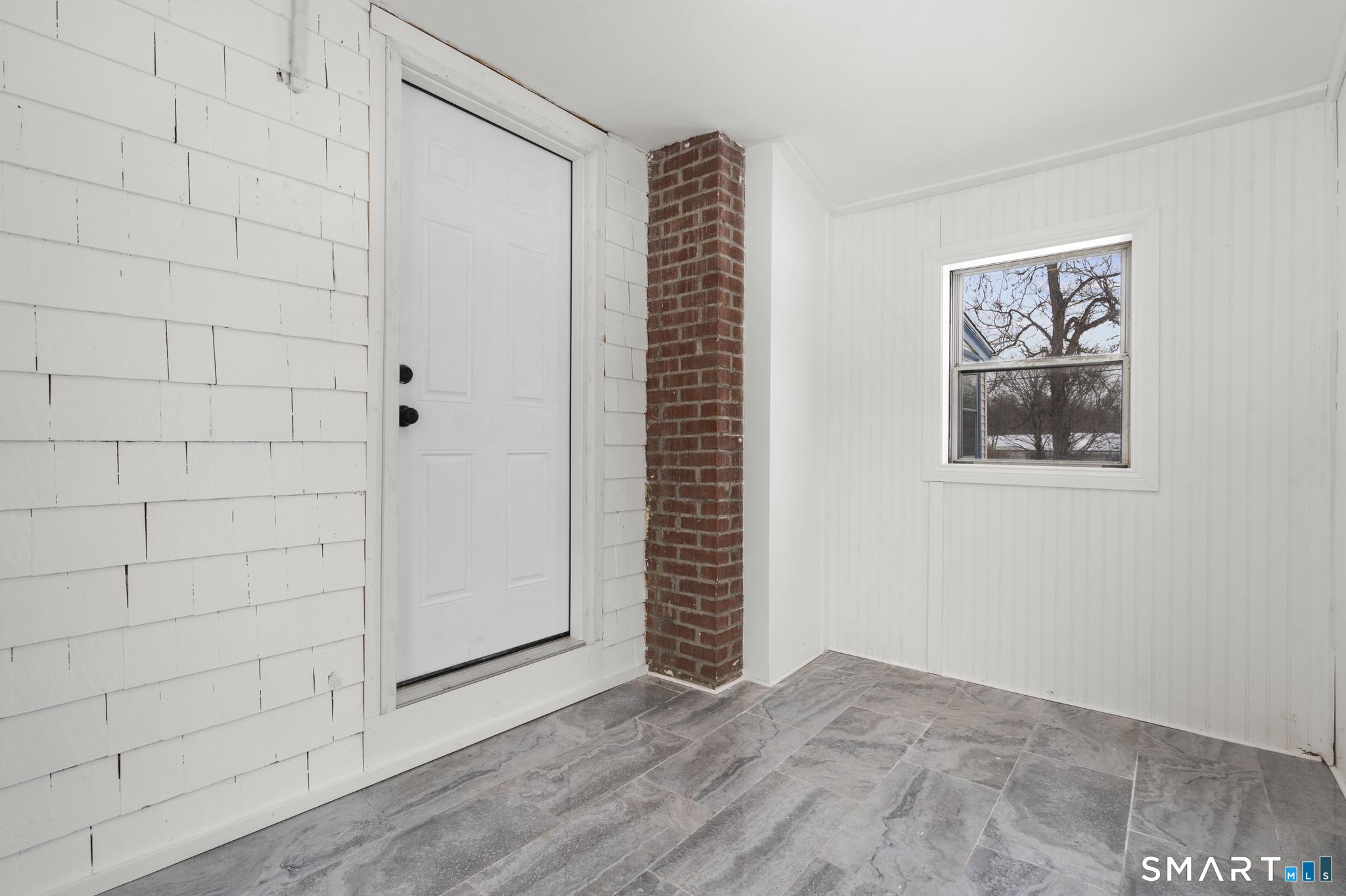 165 Ballamahack Road Windham, CT 06280 - Photo 4 of 40 a view of an empty room with a window