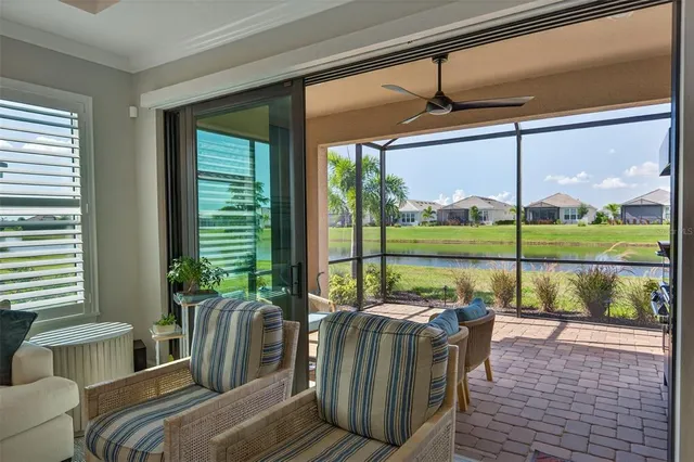 a living room with furniture a table and white walls