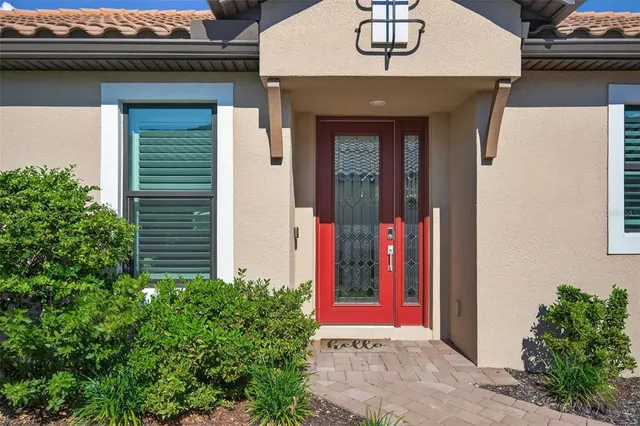 a front view of a house with red gate
