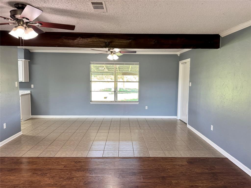 4170 Farm To Market 51 Decatur, TX 76234 - Photo 12 of 34 a view of an empty room with window and wooden floor