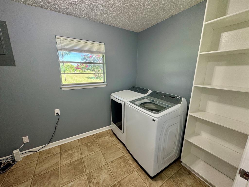4170 Farm To Market 51 Decatur, TX 76234 - Photo 26 of 34 a utility room with dryer and washer
