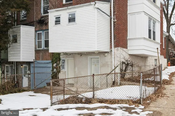 a view of a house with a small yard