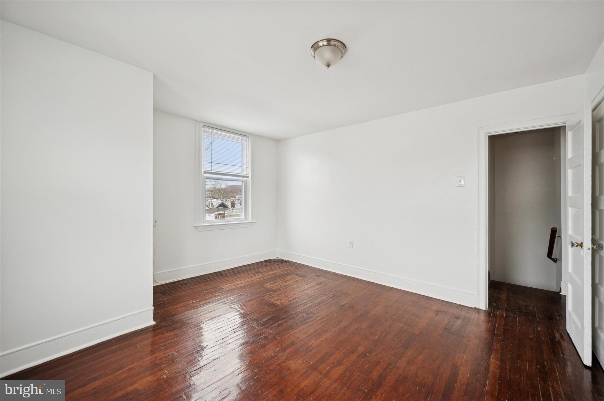 2000 Widener Place, Unit 1 Philadelphia, PA 19138 - Photo 5 of 15 an empty room with wooden floor and windows