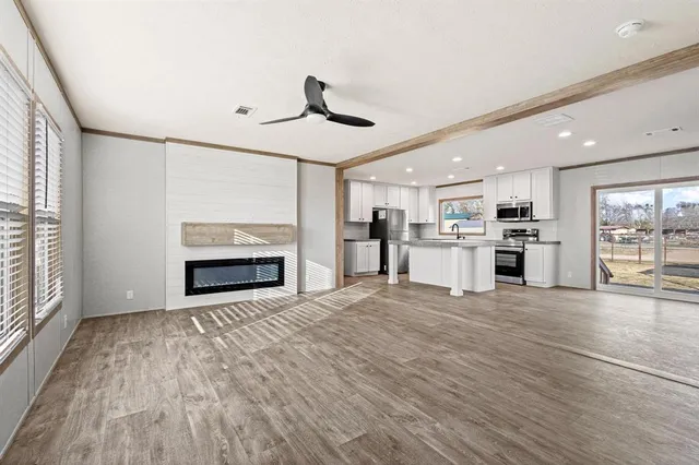 a view of a kitchen with a stove cabinets and wooden floor