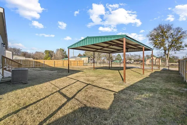 a view of patio with swimming pool