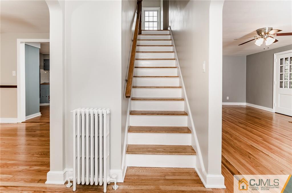 127 Plainsboro Road Cranbury, NJ 08512 - Photo 2 of 25 a view of a hallway with wooden floor and entryway