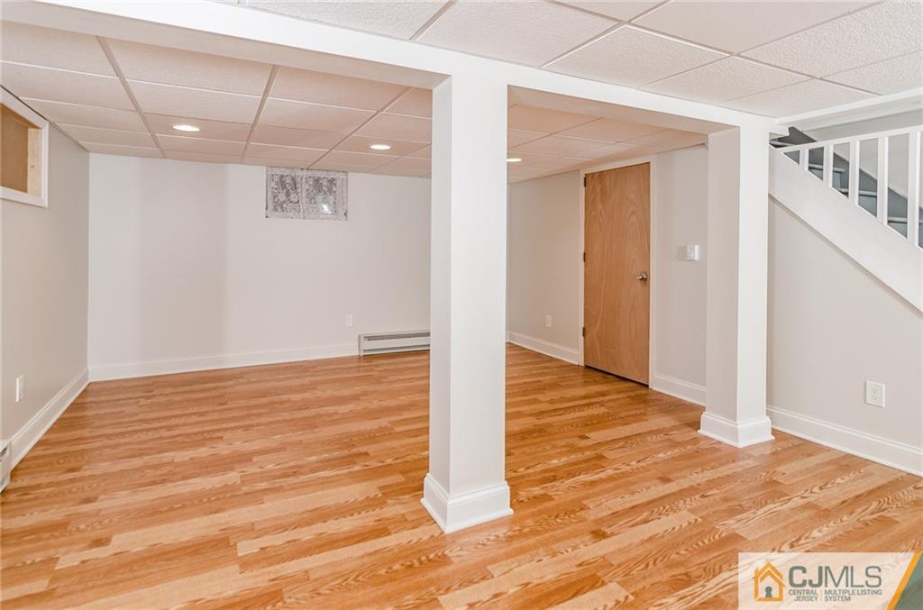 127 Plainsboro Road Cranbury, NJ 08512 - Photo 14 of 25 a view of an empty room with wooden floor
