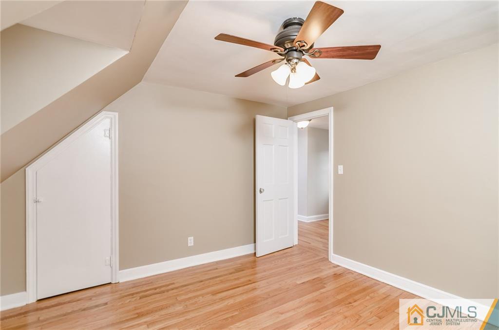 127 Plainsboro Road Cranbury, NJ 08512 - Photo 20 of 25 a view of an empty room with wooden floor