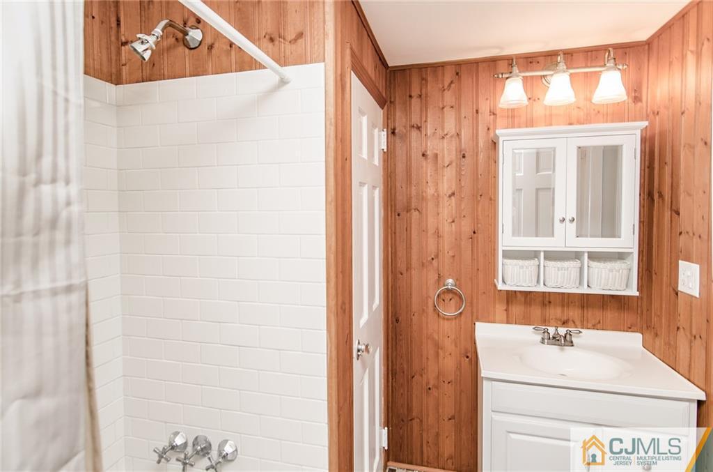 127 Plainsboro Road Cranbury, NJ 08512 - Photo 21 of 25 a bathroom with a sink and a mirror