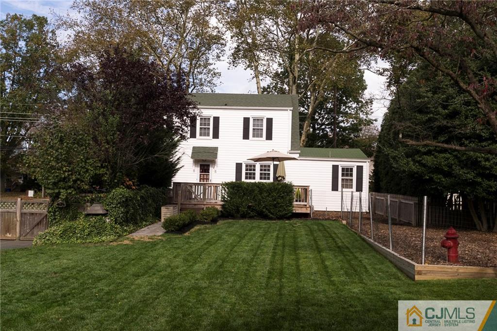 127 Plainsboro Road Cranbury, NJ 08512 - Photo 22 of 25 a front view of a house with a yard