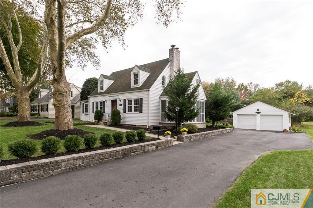 127 Plainsboro Road Cranbury, NJ 08512 - Photo 25 of 25 a view of a house with a yard and table and chairs in a yard