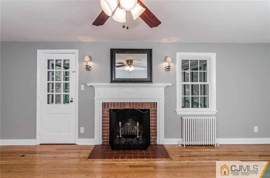 127 Plainsboro Road Cranbury, NJ 08512 - Photo 5 of 25 a living room with furniture and a fireplace