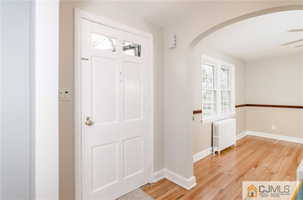 127 Plainsboro Road Cranbury, NJ 08512 - Photo 6 of 25 view of an empty room with wooden floor and a window