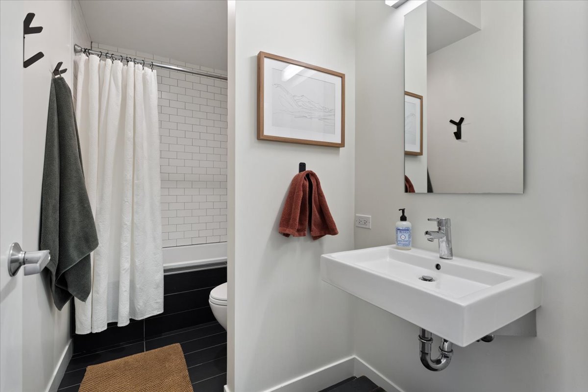 2638 North Ridgeway Avenue Chicago, IL 60647 - Photo 24 of 31 a bathroom with a sink and a mirror
