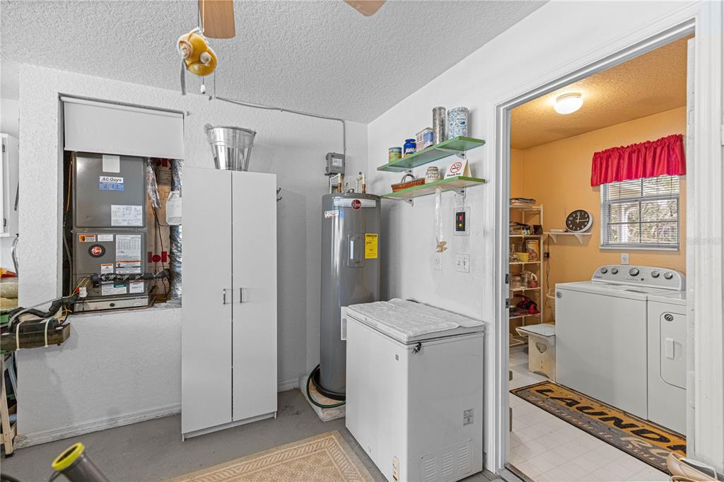 8534 Southwest 108th Pl Road Ocala, FL 34481 - Photo 25 of 41 a utility room with refrigerator and washer